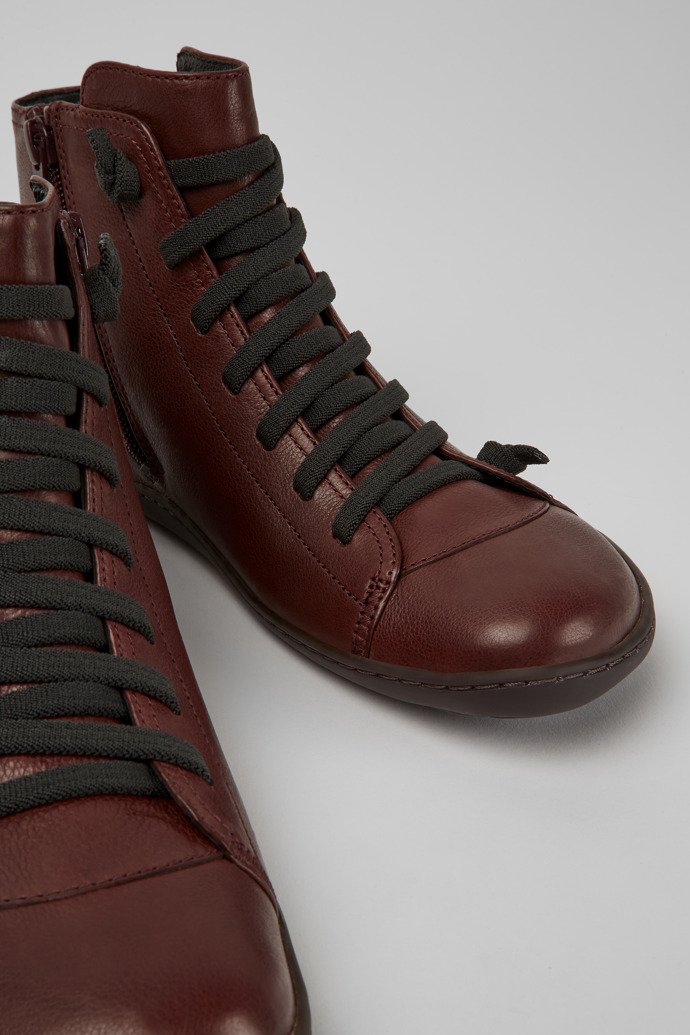 Close-up view of Peu Burgundy leather ankle boots