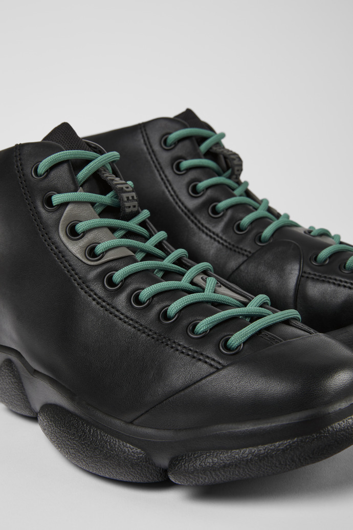 Close-up view of Karst Black leather sneakers for women
