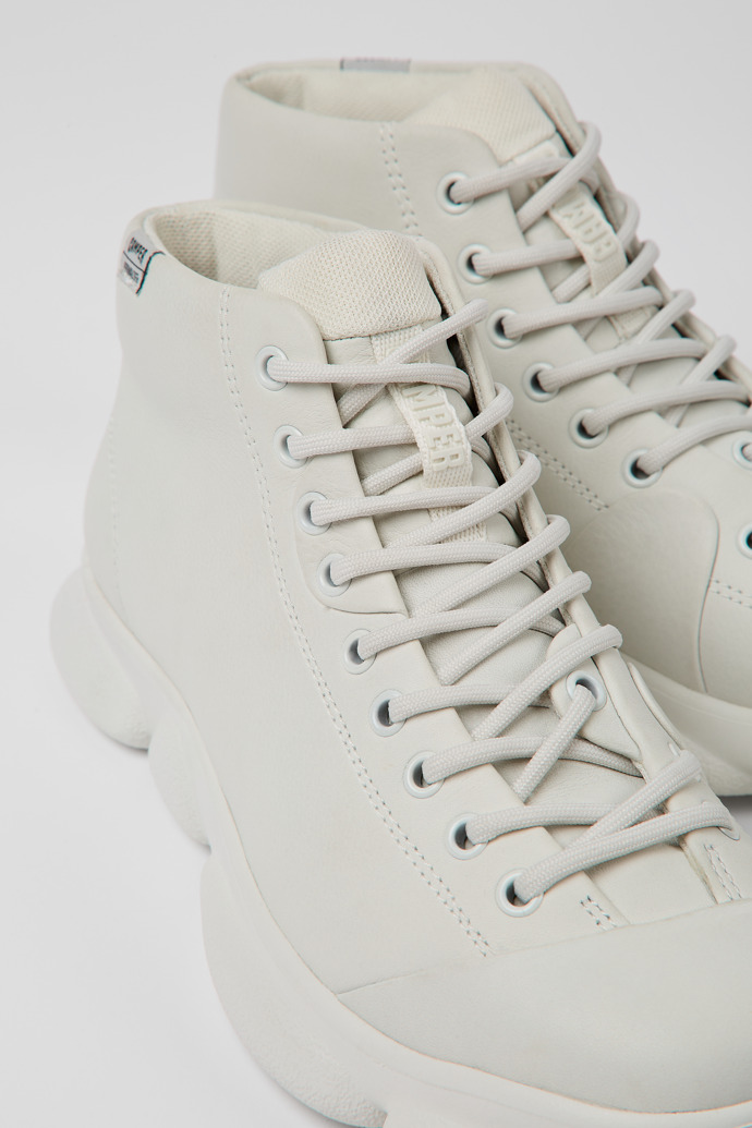 Close-up view of Karst White non-dyed leather sneakers for women