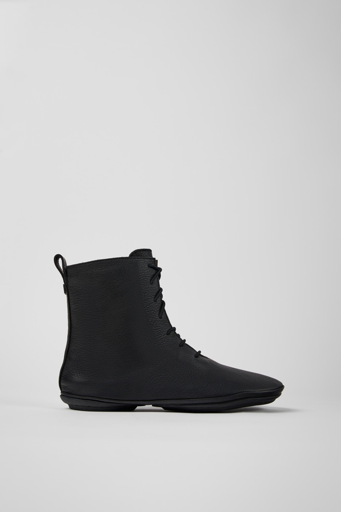 Side view of Right Black leather ankle boots