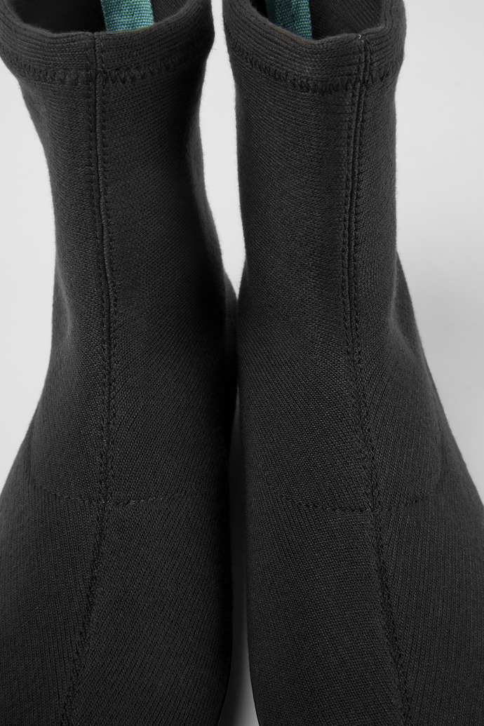 Close-up view of Right Black ankle boots