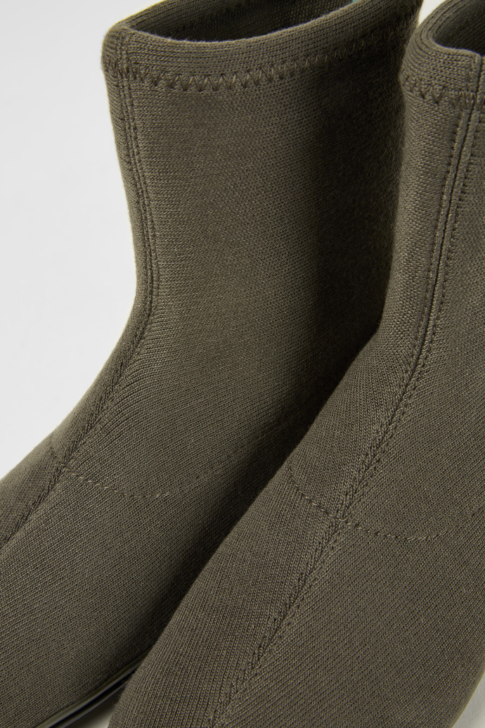 Close-up view of Right Green ankle boots
