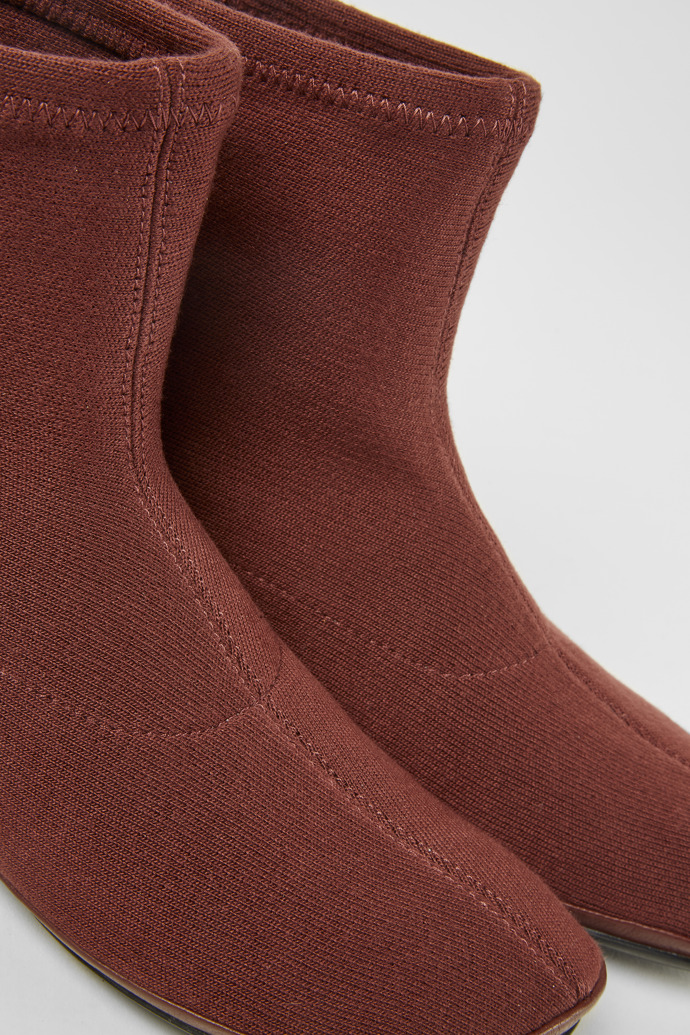 Close-up view of Right Burgundy ankle boots