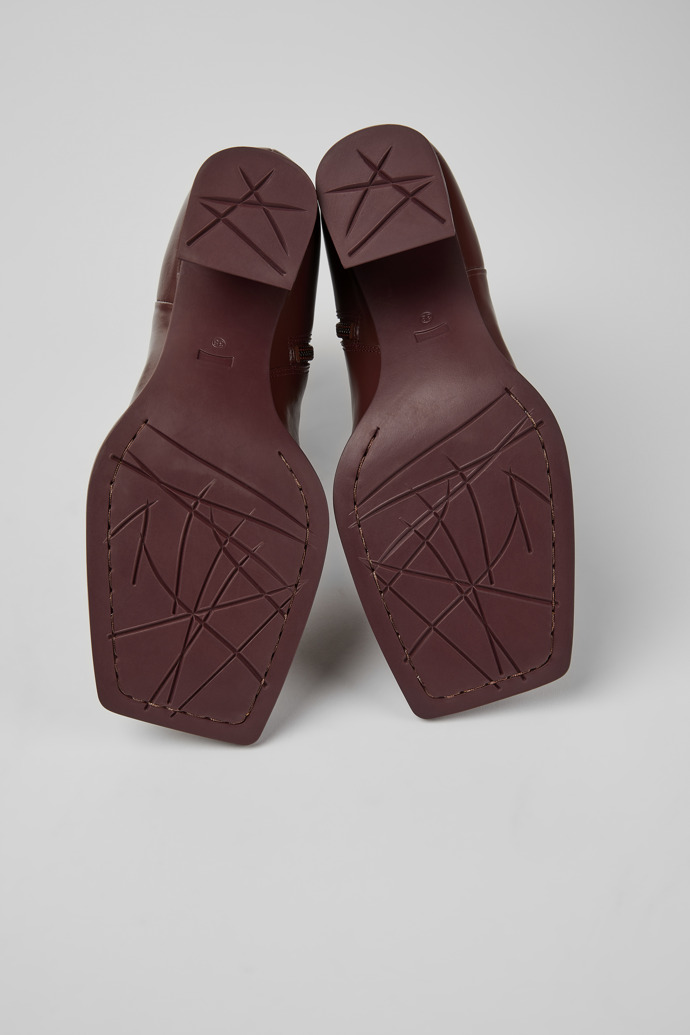 The soles of Karole Burgundy leather ankle boots for women