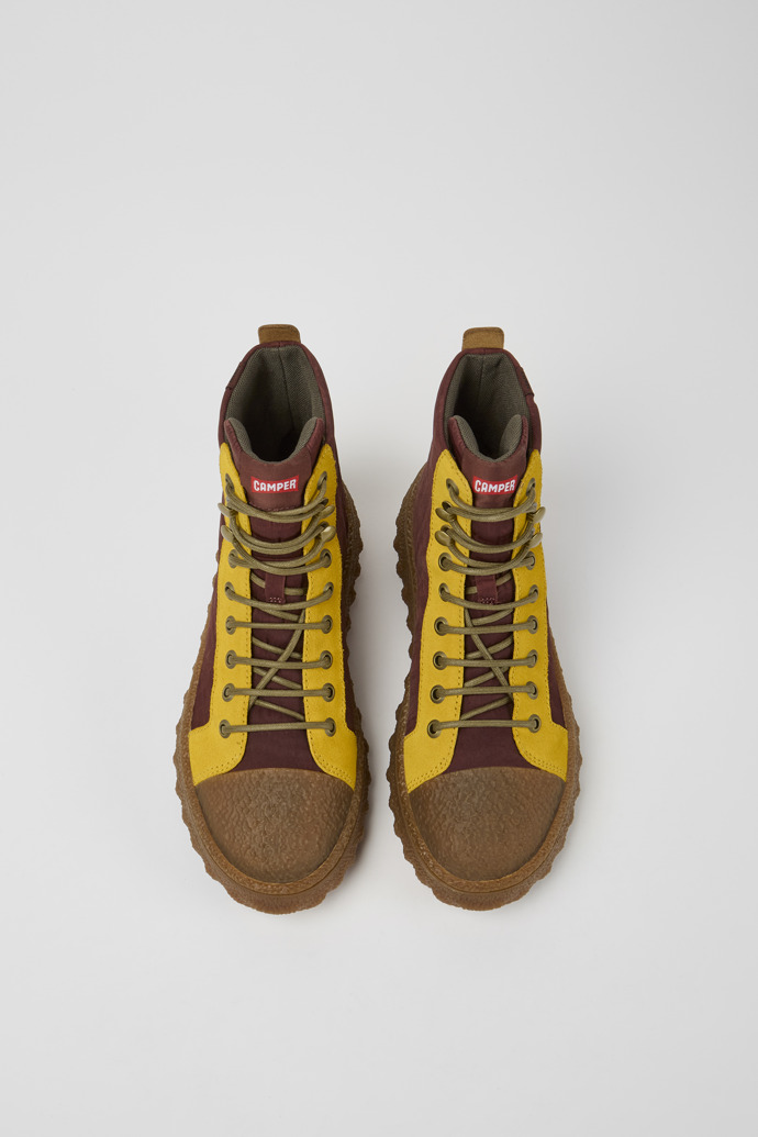 Overhead view of Ground Burgundy and yellow ankle boots