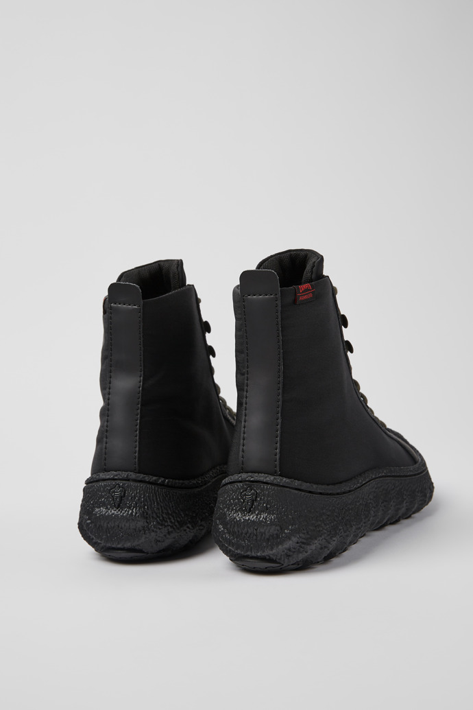 Back view of Ground PrimaLoft® Black textile and leather ankle boots for women