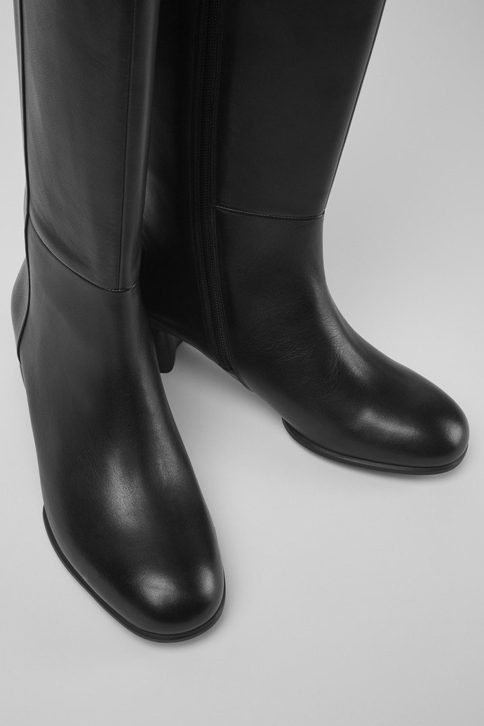 Close-up view of Katie Black leather boots with heels