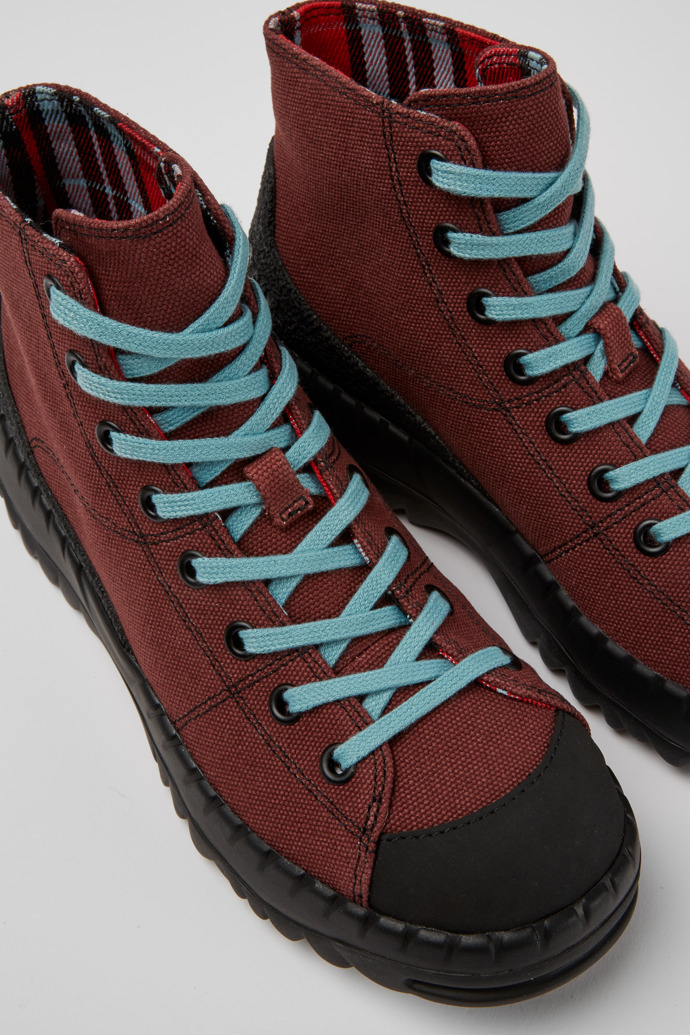Close-up view of Teix Burgundy rubber and BCI cotton boots