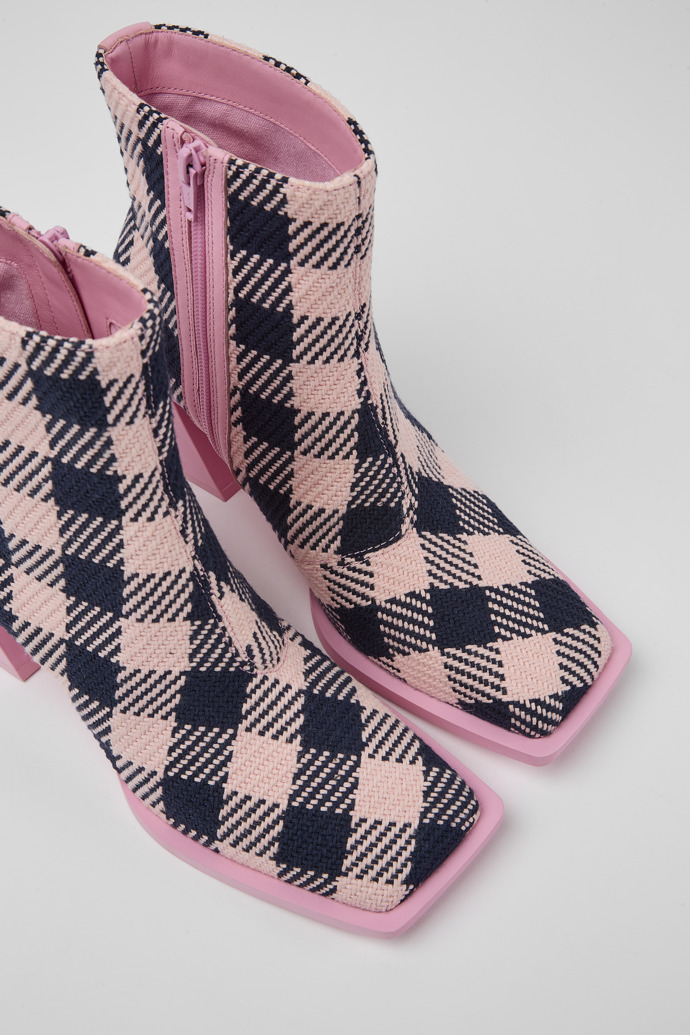 Close-up view of Karole Pink and black cotton boots for women