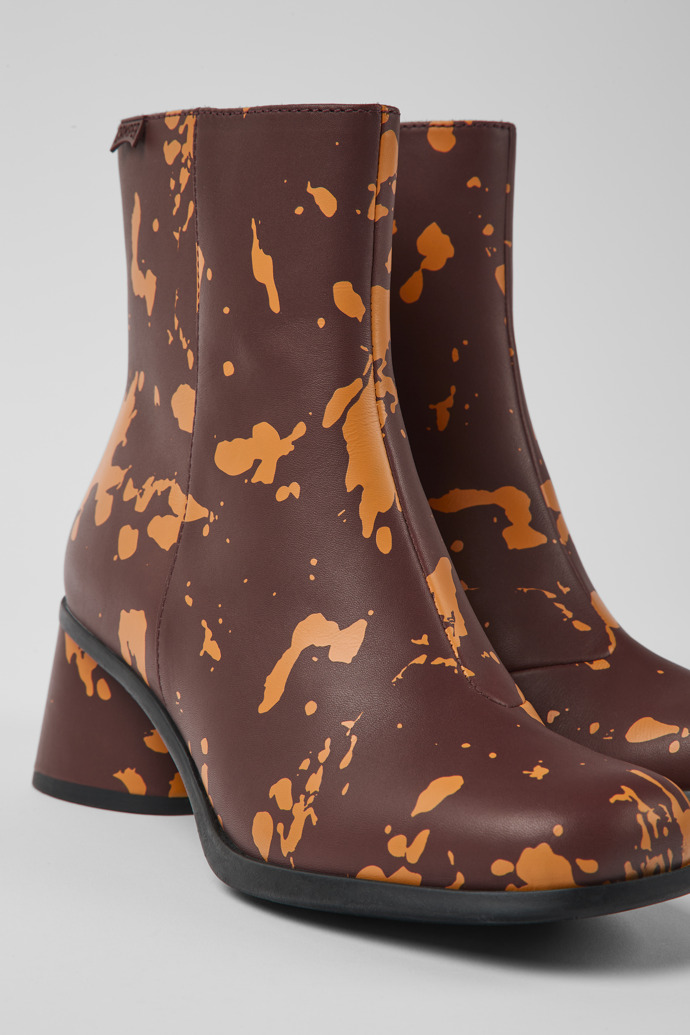 Close-up view of Kiara Burgundy and orange printed leather ankle boots