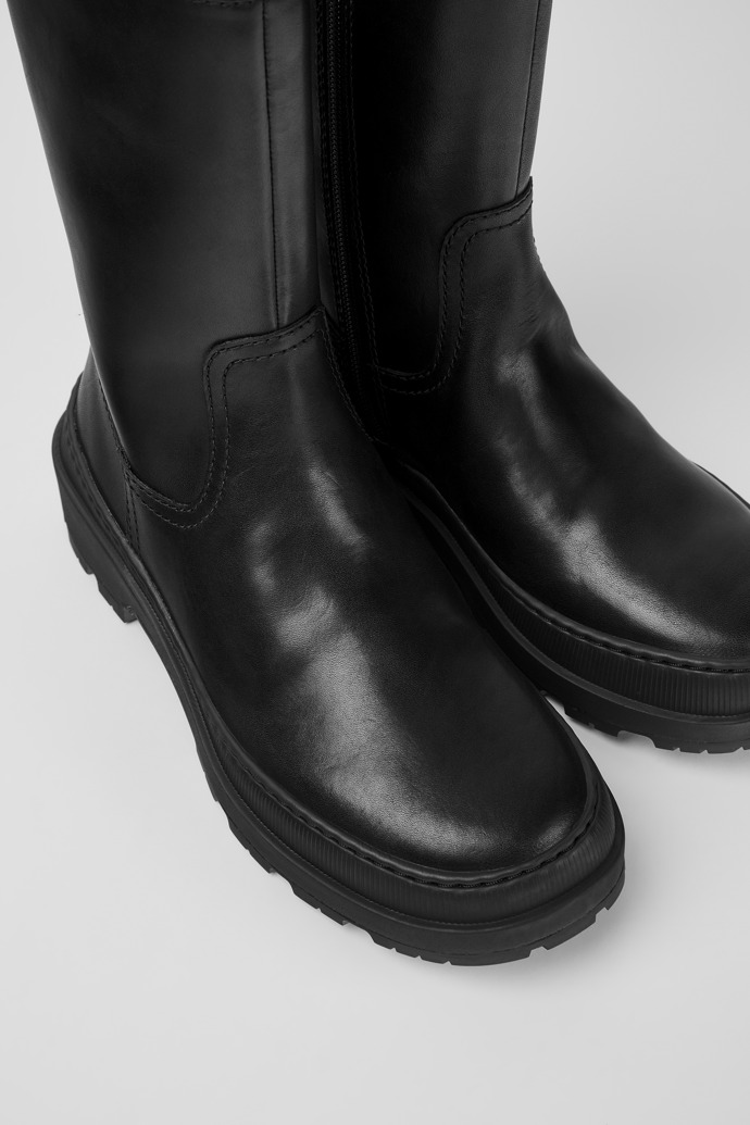 Close-up view of Brutus Trek Black leather ankle boots for women