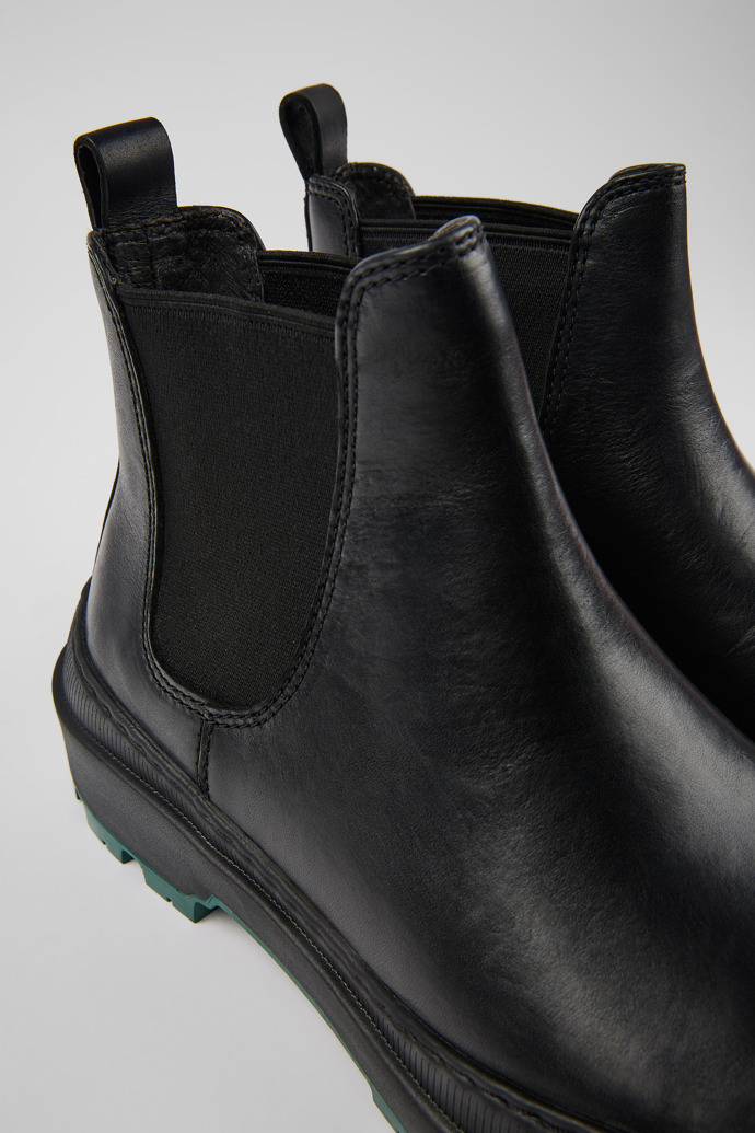 Close-up view of Brutus Trek Black leather ankle boots for women