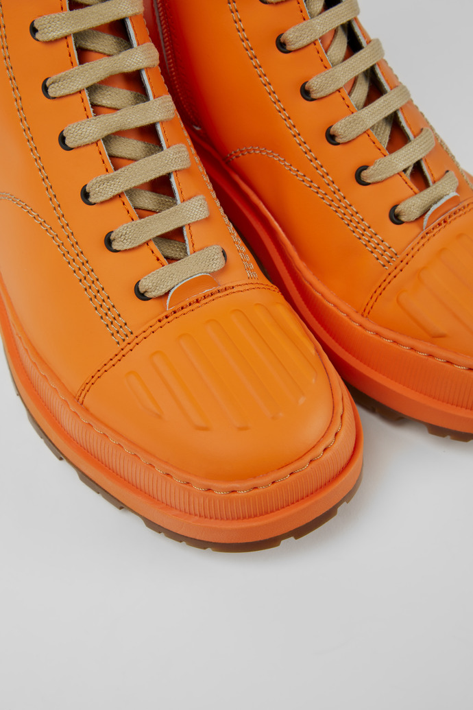 Close-up view of Brutus Trek Orange leather ankle boots for women