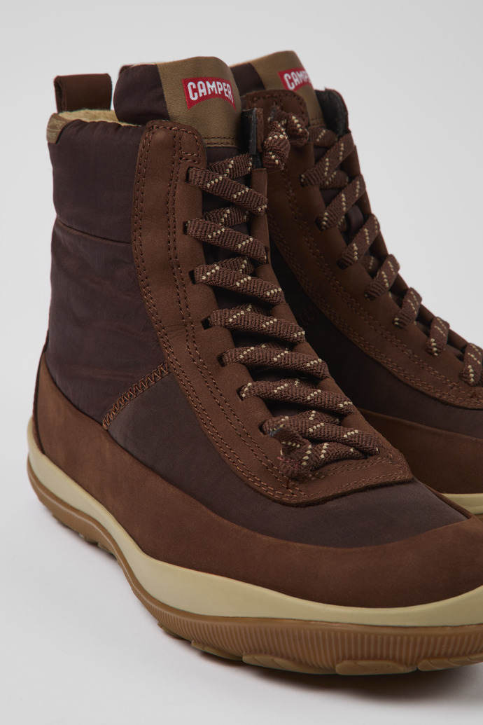 Close-up view of Peu Pista Brown recycled nylon and leather boots for women