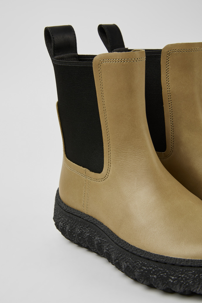 Close-up view of Ground Beige leather ankle boots for women