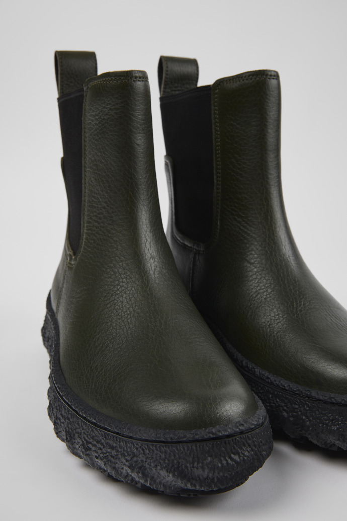 Close-up view of Ground Green leather ankle boots for women