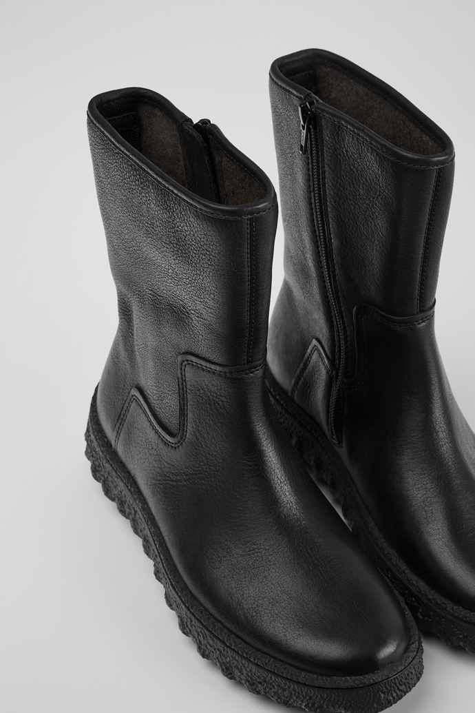 Close-up view of Ground Black leather boots for women