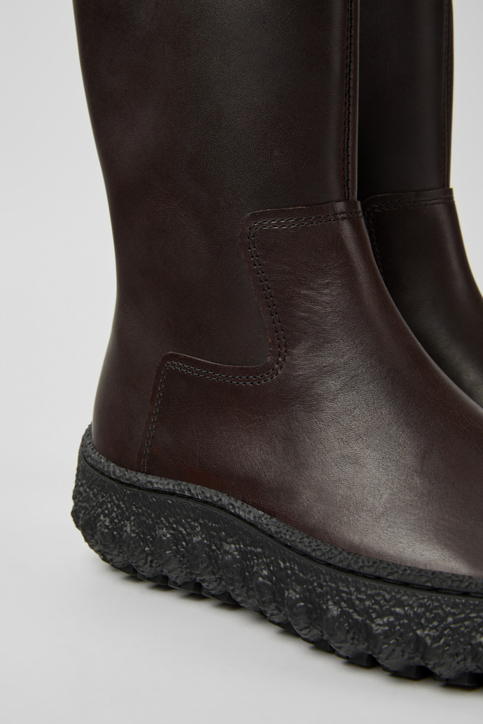 Close-up view of Ground Dark brown leather boots for women