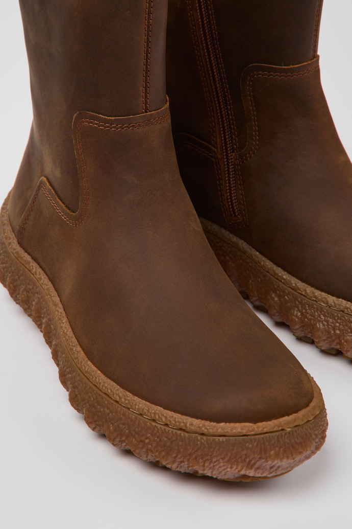 Close-up view of Ground Brown nubuck boots for women