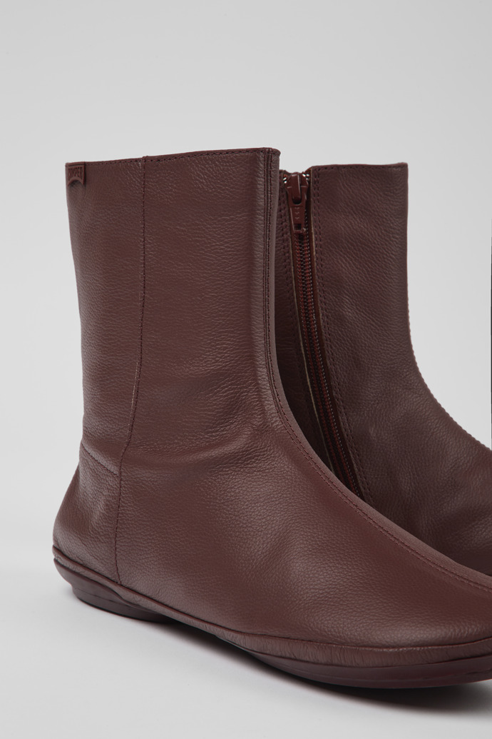 Close-up view of Right Burgundy leather boots for women
