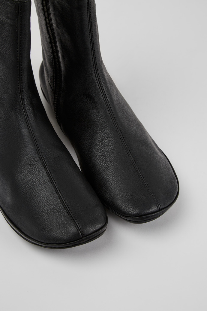 Close-up view of Right Black leather boots for women