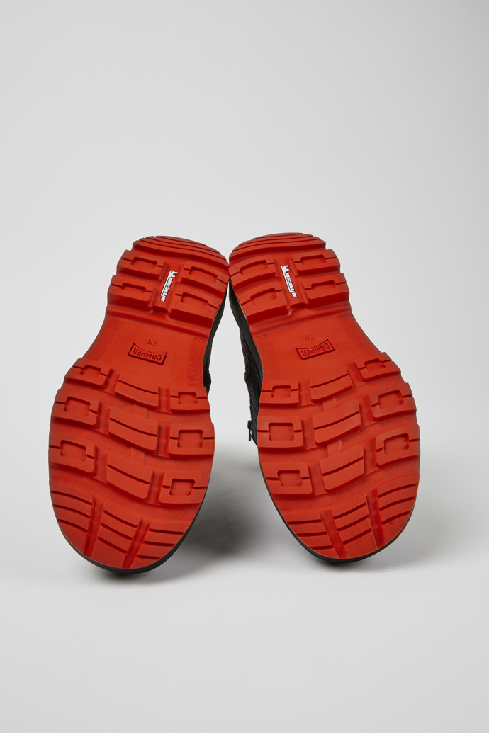 The soles of Brutus Trek Black nubuck ankle boots for women