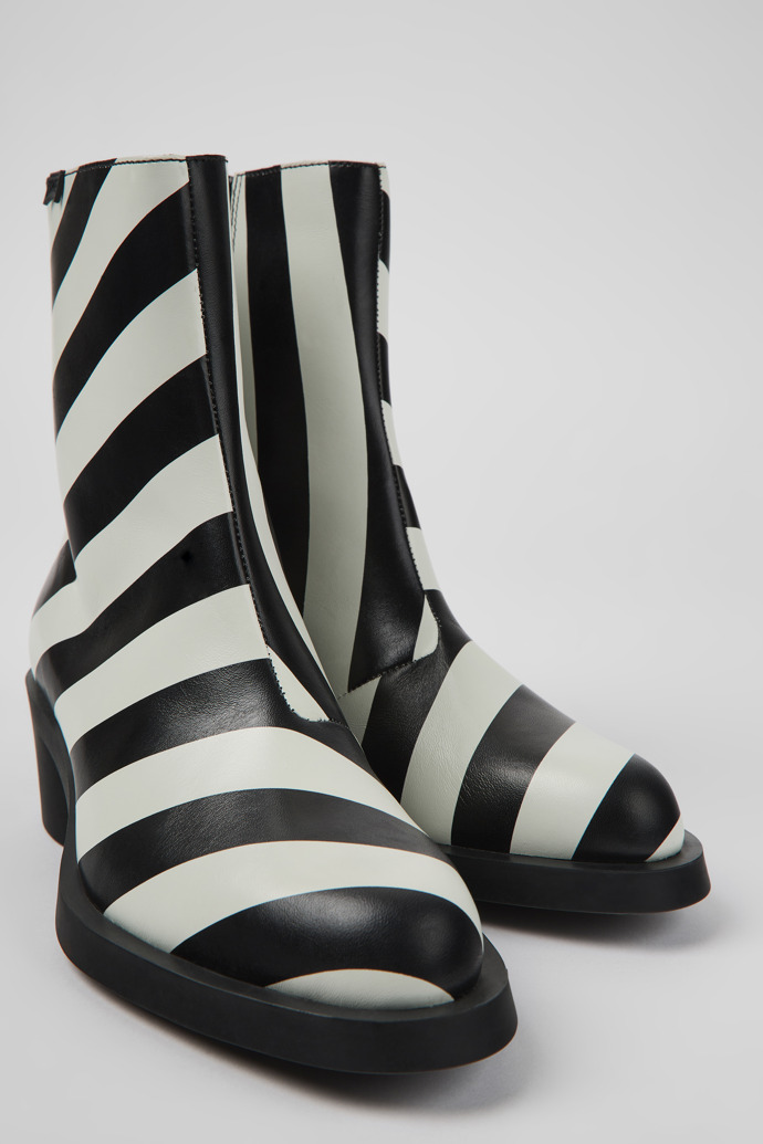 Close-up view of Bonnie Black and white striped leather boots for women