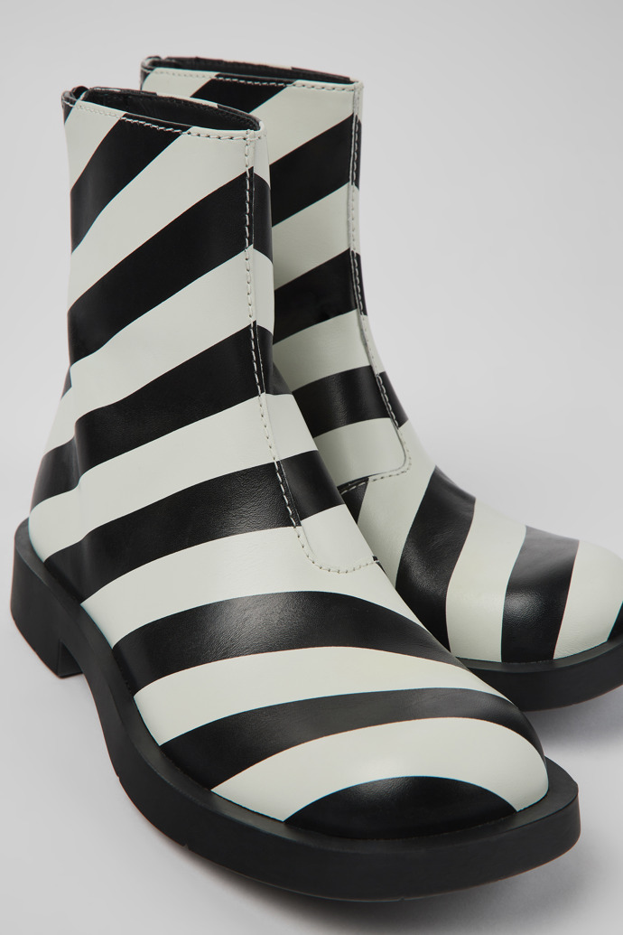 Close-up view of MIL 1978 Black and white leather ankle boots for women