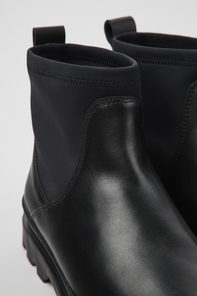 Close-up view of Brutus Black leather and textile ankle boots for women