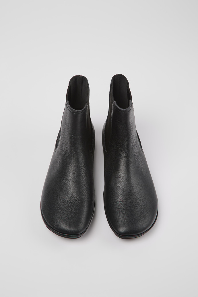 Overhead view of Right Black leather ankle boots