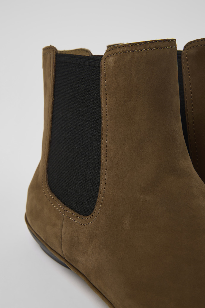 Close-up view of Right Brown nubuck ankle boots