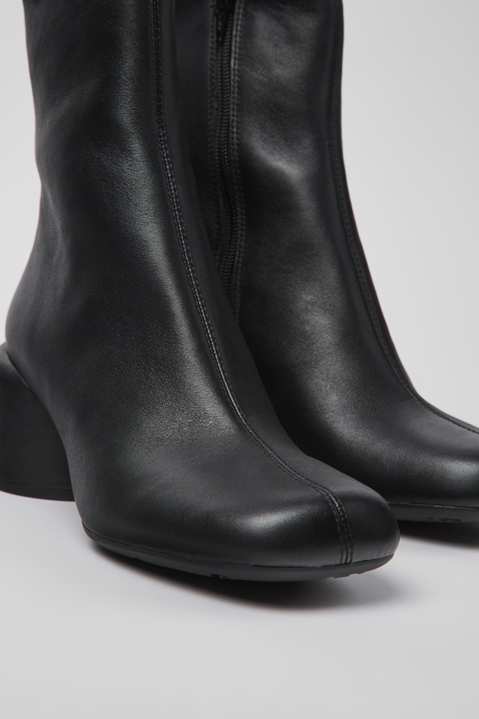 Close-up view of Niki Black leather boots for women