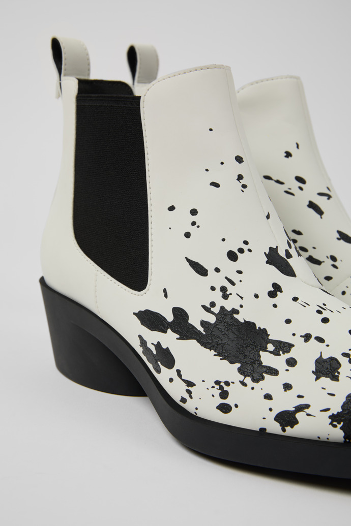 Close-up view of Bonnie White and black leather ankle boots for women