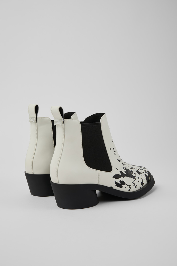 Back view of Bonnie White and black leather ankle boots for women