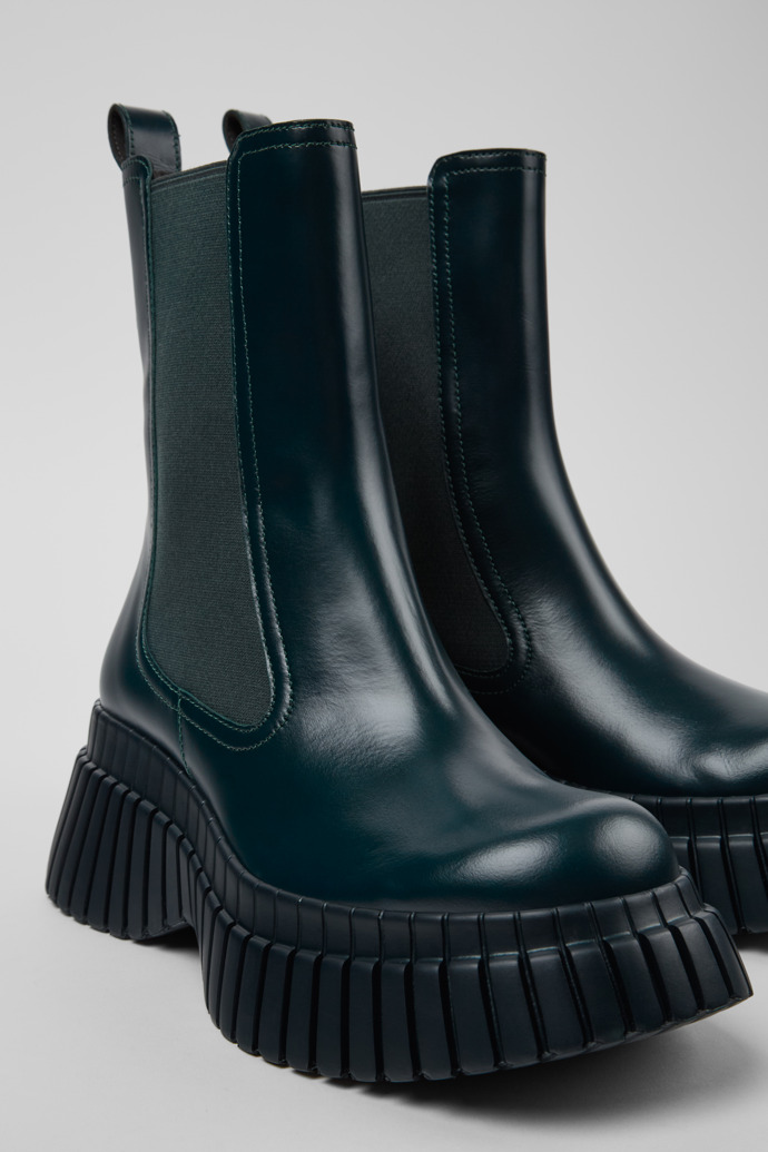 Close-up view of BCN Green leather chelsea boots for women