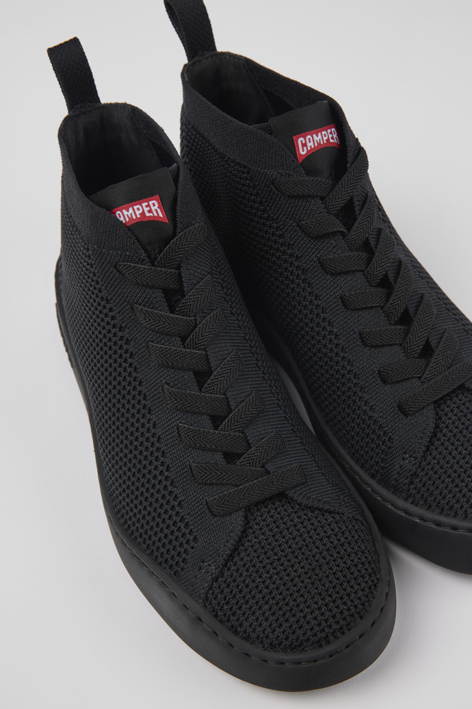 Close-up view of Peu Touring Black one-piece knit sneakers for women