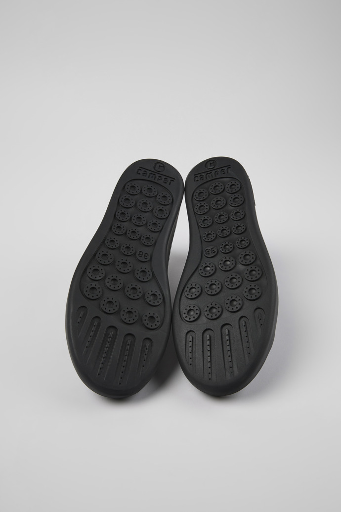 The soles of Peu Touring Black one-piece knit sneakers for women