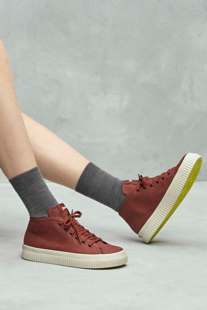 A model wearing Peu Roda Red recycled cotton sneakers for women