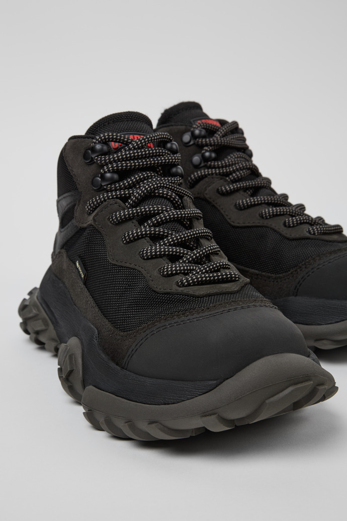 Close-up view of Karst Trek Black and gray ankle boots for women