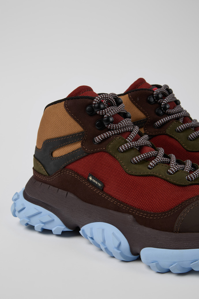 Close-up view of Karst Trek Brown and red ankle boots for women