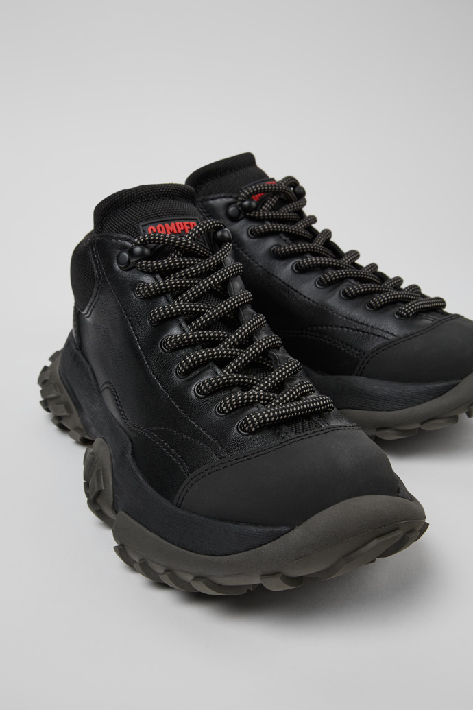 Close-up view of Karst Trek Black ankle boots for women