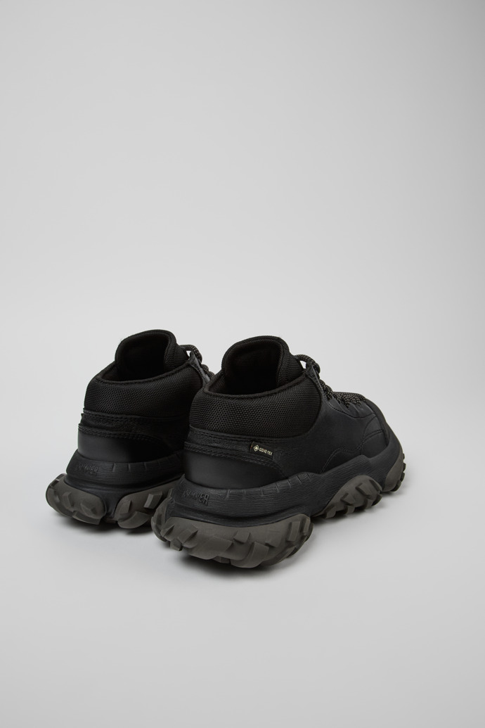 Back view of Karst Trek Black ankle boots for women