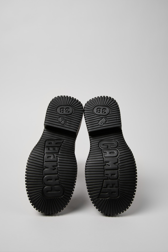 The soles of Pix Berlin Black Nubuck Mid Boots for Women.