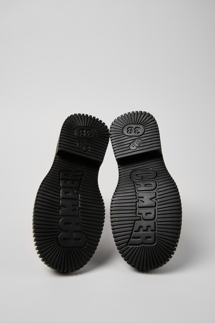 The soles of Pix Berlin Black Leather Mid Boots for Women.