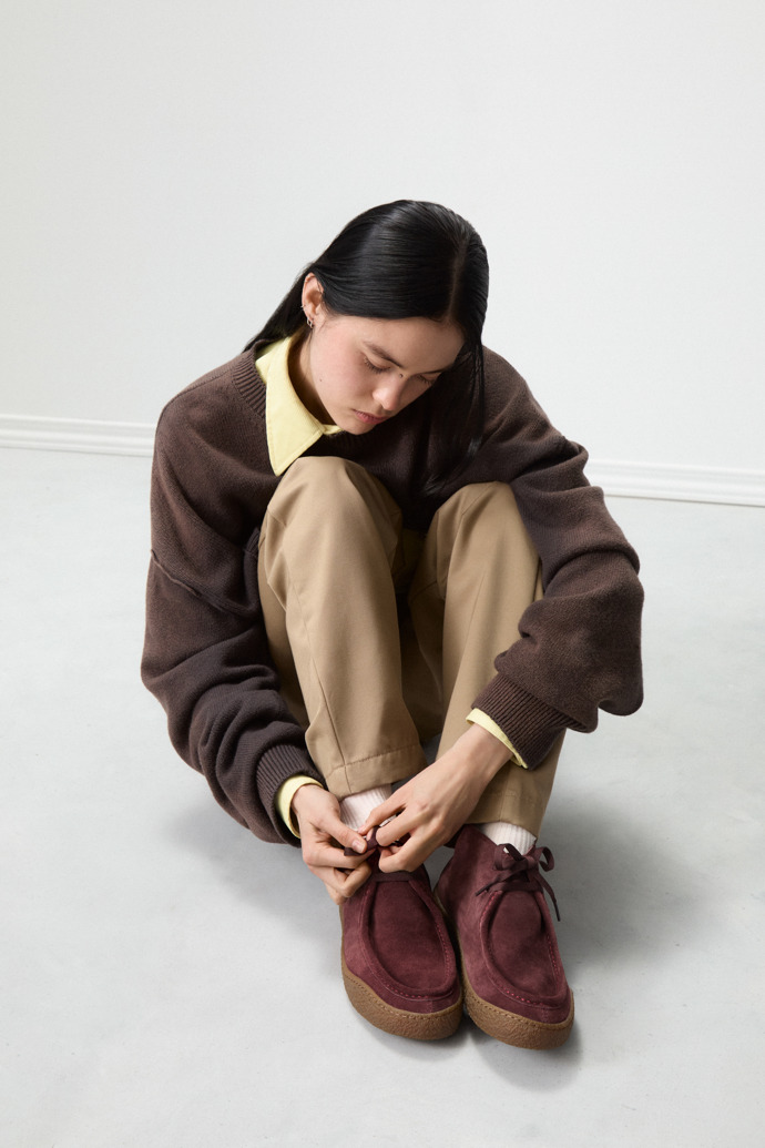 A model wearing Peu Terreno Burgundy Nubuck Ankle Boots for Women.