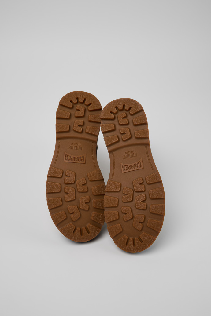 The soles of Brutus+ Gray Leather Mid Boots for Women.