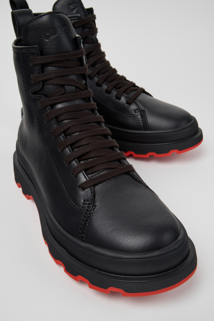 Close-up view of Brutus+ Black Leather Mid Boots for Women.