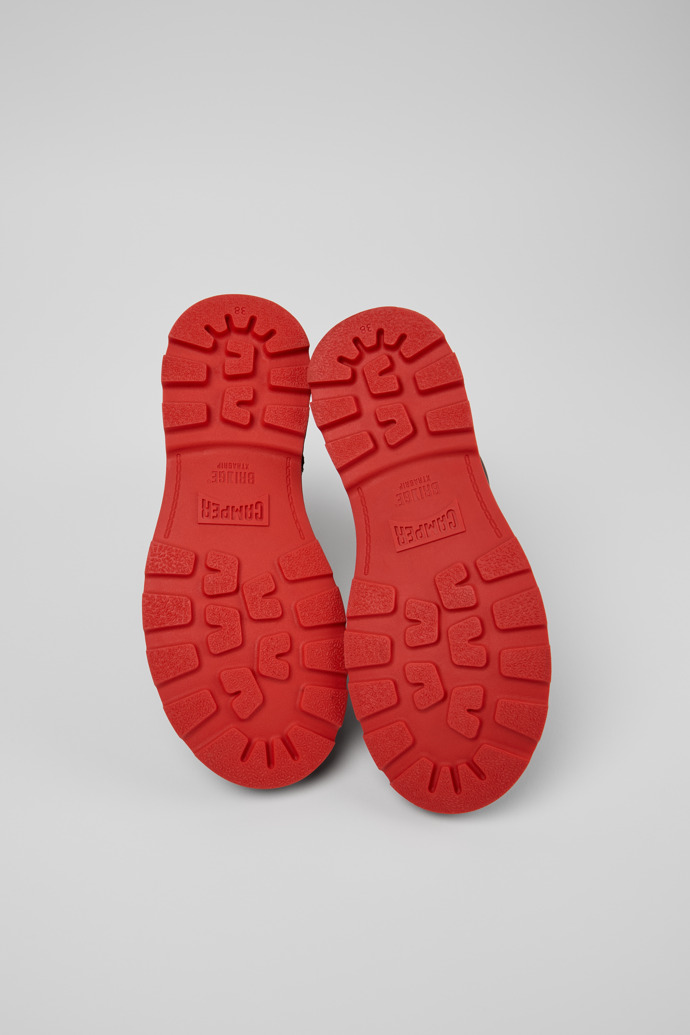 The soles of Brutus+ Black Leather Mid Boots for Women.