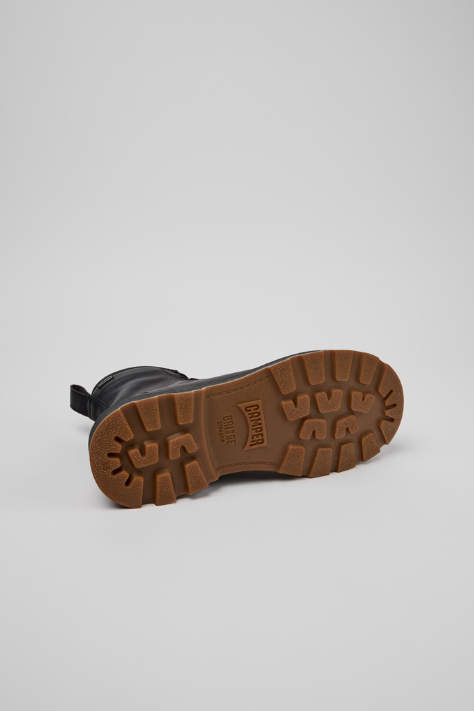 The soles of Brutus+ Black Leather Ankle Boots for Women.