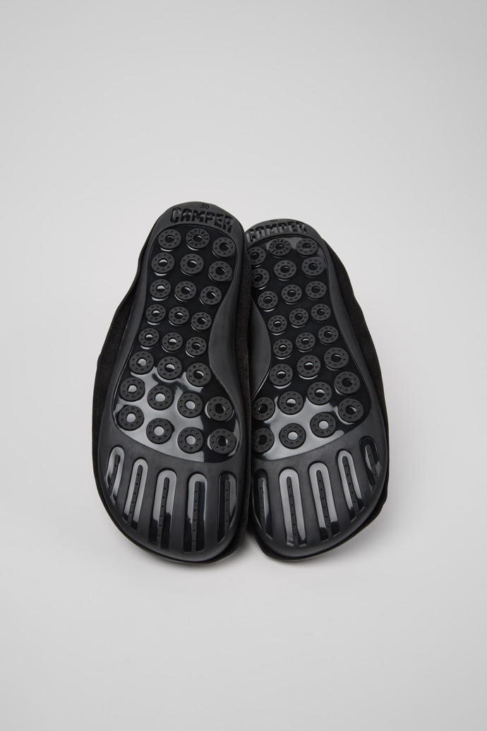The soles of Camper x ISSEY MIYAKE - Peu Form Black Leather Ankle Boots for Women.